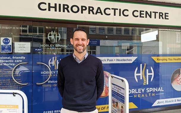 Photo of an outside MBST clinic Horley Spinal Health with their clinician stood outside smiling