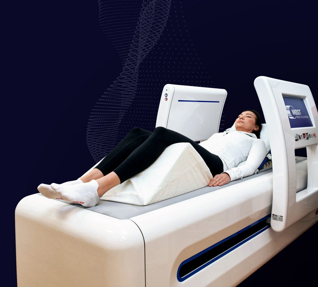 Image of a patient laying comfortably on the MBST Arthro Spin Flex device